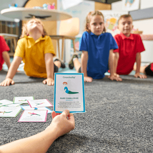 Kids using Crunch&Sip yoga cards